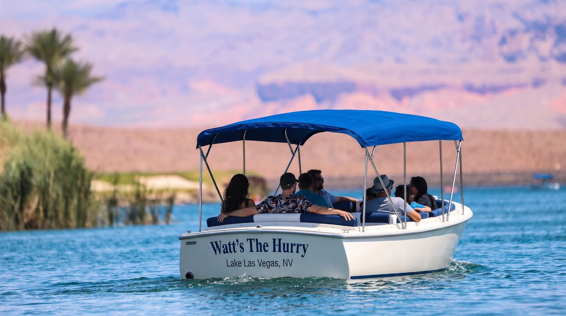 Watt’s The Hurry Regular electric boat cruising past the Lake Las Vegas shoreline
